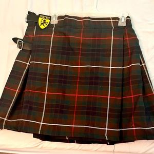 Green Tartan Sport Kilt: Pleated, with adjustable leather buckle straps.